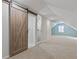 Stylish bathroom with barn door and glass shower at 1974 Browns Mill Se Rd, Atlanta, GA 30315