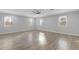 Large bedroom with hardwood floors and multiple windows at 1974 Browns Mill Se Rd, Atlanta, GA 30315
