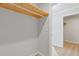 Spacious closet with wood shelving and hanging rod at 1974 Browns Mill Se Rd, Atlanta, GA 30315