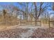 View of the wooden deck with railing, surrounded by trees, in a tranquil outdoor setting at 1974 Browns Mill Se Rd, Atlanta, GA 30315