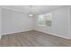 Bright dining room with hardwood floors and large window at 1974 Browns Mill Se Rd, Atlanta, GA 30315