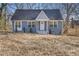 Charming blue house with white trim and a covered porch at 1974 Browns Mill Se Rd, Atlanta, GA 30315