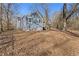 Side view of a grey house with wooden deck and steps at 1974 Browns Mill Se Rd, Atlanta, GA 30315