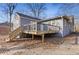 Grey house with a large deck and wooden stairs at 1974 Browns Mill Se Rd, Atlanta, GA 30315