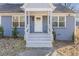 Quaint front porch with white railings and steps at 1974 Browns Mill Se Rd, Atlanta, GA 30315