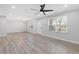 Bright and airy living room with hardwood floors and ceiling fan at 1974 Browns Mill Se Rd, Atlanta, GA 30315