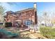 Brick patio, deck, and grassy yard with a playset at 63 Habersham Cove Nw Ln, Atlanta, GA 30305