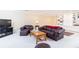 Finished basement with leather furniture, built in shelving and large TV at 63 Habersham Cove Nw Ln, Atlanta, GA 30305