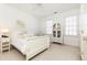 Bright bedroom with white sleigh bed, window seating and built in shelving at 63 Habersham Cove Nw Ln, Atlanta, GA 30305