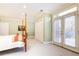 Bright bedroom with a queen-size bed and French doors leading to backyard at 63 Habersham Cove Nw Ln, Atlanta, GA 30305