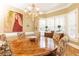 Formal dining room featuring a large round table and chandelier at 63 Habersham Cove Nw Ln, Atlanta, GA 30305