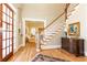 Elegant entryway with hardwood floors and staircase at 63 Habersham Cove Nw Ln, Atlanta, GA 30305