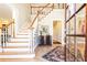 Two-story foyer with hardwood floors and elegant staircase at 63 Habersham Cove Nw Ln, Atlanta, GA 30305