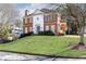 Two story brick home with manicured lawn at 63 Habersham Cove Nw Ln, Atlanta, GA 30305