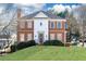 Brick two-story house with a manicured lawn at 63 Habersham Cove Nw Ln, Atlanta, GA 30305