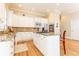 Bright kitchen boasts granite countertops, white cabinets, and hardwood floors at 63 Habersham Cove Nw Ln, Atlanta, GA 30305