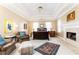 Spacious main bedroom with fireplace, hardwood floors, and sitting area at 63 Habersham Cove Nw Ln, Atlanta, GA 30305