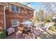 Brick patio with seating area and adjacent deck at 63 Habersham Cove Nw Ln, Atlanta, GA 30305