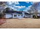 Home's back elevation, patio, and fenced backyard at 758 Shoreline Se Trl, Conyers, GA 30094