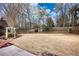 Large backyard with a storage shed and fenced perimeter at 758 Shoreline Se Trl, Conyers, GA 30094