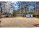 Spacious backyard with storage shed and large grassy area at 758 Shoreline Se Trl, Conyers, GA 30094
