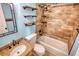 Updated bathroom with tile shower/tub combo and granite vanity at 758 Shoreline Se Trl, Conyers, GA 30094