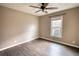 Bright bedroom featuring hardwood floors and a ceiling fan at 758 Shoreline Se Trl, Conyers, GA 30094