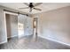 Bedroom with sliding barn door and ceiling fan at 758 Shoreline Se Trl, Conyers, GA 30094