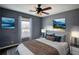 Spacious bedroom with wood-look floors and ceiling fan at 758 Shoreline Se Trl, Conyers, GA 30094