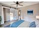 Bedroom with sliding barn door and ceiling fan at 758 Shoreline Se Trl, Conyers, GA 30094