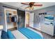 Bedroom with barn door, walk-in closet, and ceiling fan at 758 Shoreline Se Trl, Conyers, GA 30094