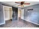 Bedroom with barn door, walk-in closet, and ceiling fan at 758 Shoreline Se Trl, Conyers, GA 30094