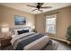 Spacious bedroom with ceiling fan and large window at 758 Shoreline Se Trl, Conyers, GA 30094