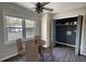 Bright dining area with a wood table and chairs, and access to laundry at 758 Shoreline Se Trl, Conyers, GA 30094