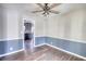 Dining room with hardwood floors, two-tone walls, and kitchen view at 758 Shoreline Se Trl, Conyers, GA 30094