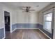 Dining room with hardwood floors and two-tone walls at 758 Shoreline Se Trl, Conyers, GA 30094