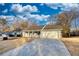 House exterior showcasing a large yard and driveway at 758 Shoreline Se Trl, Conyers, GA 30094