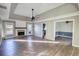 Open living room with hardwood floors and a fireplace at 758 Shoreline Se Trl, Conyers, GA 30094