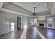 Large living room featuring a fireplace and hardwood floors at 758 Shoreline Se Trl, Conyers, GA 30094