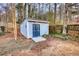 Detached shed in backyard with double doors at 758 Shoreline Se Trl, Conyers, GA 30094