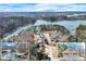 Stunning aerial view of lakefront homes with private docks and lush surrounding trees, offering a serene lifestyle at 2843 Merritt Dr, Buford, GA 30518