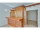 Unfinished basement bar area with wooden counter and shelving at 2843 Merritt Dr, Buford, GA 30518