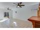 Finished basement with tile flooring, ceiling fan, and sliding glass doors at 2843 Merritt Dr, Buford, GA 30518