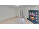 Finished basement with fireplace and tile flooring at 2843 Merritt Dr, Buford, GA 30518