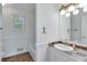 Clean bathroom with updated vanity and tile flooring at 2843 Merritt Dr, Buford, GA 30518