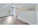 Bright bedroom with hardwood floors and a glass block wall at 2843 Merritt Dr, Buford, GA 30518