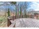 Spacious wooden deck with wooden railings and wooded views at 2843 Merritt Dr, Buford, GA 30518