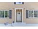 White front door with black shutters at 2843 Merritt Dr, Buford, GA 30518