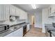 White kitchen with dark countertops at 2843 Merritt Dr, Buford, GA 30518