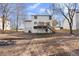 Expansive backyard featuring a two-story home with a wooden deck at 1126 Williamsburg Ln, Norcross, GA 30093
